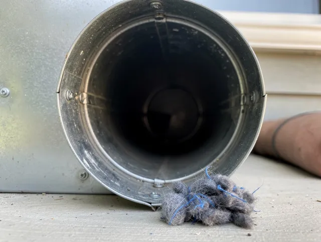 Monterey Park Dryer Vent Cleaning technician using specialized equipment to clear severe dryer vent blockage in Monterey Park